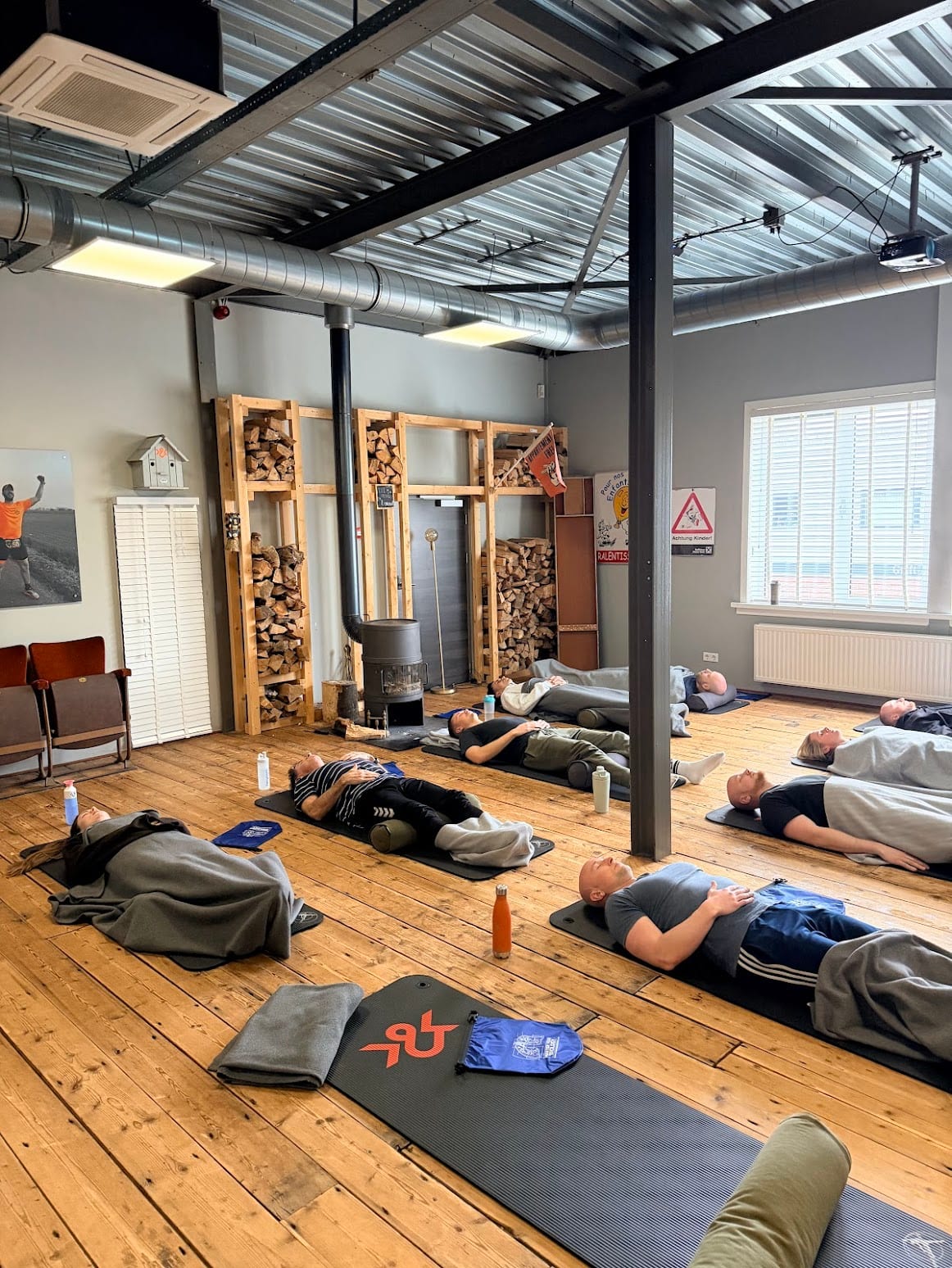 Group lying on mats during a breathwork session